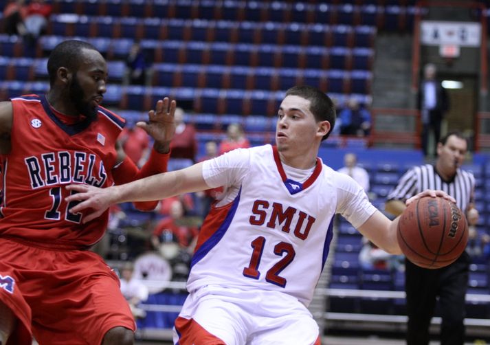 SMU's Jeremia Samarrippas fights for position against Chris Warren of Ole Miss. Photo by George Walker for DFWsportsonline.com
